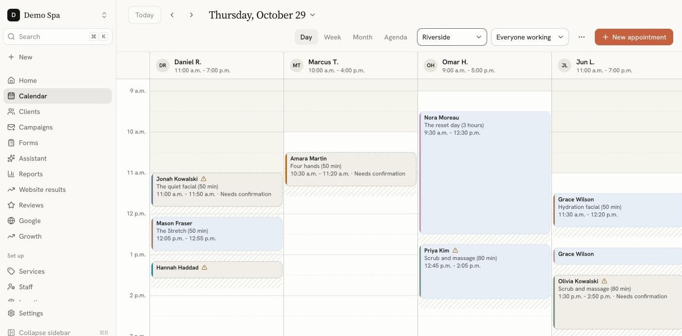The booking dashboard calendar: a day of appointments across four practitioners